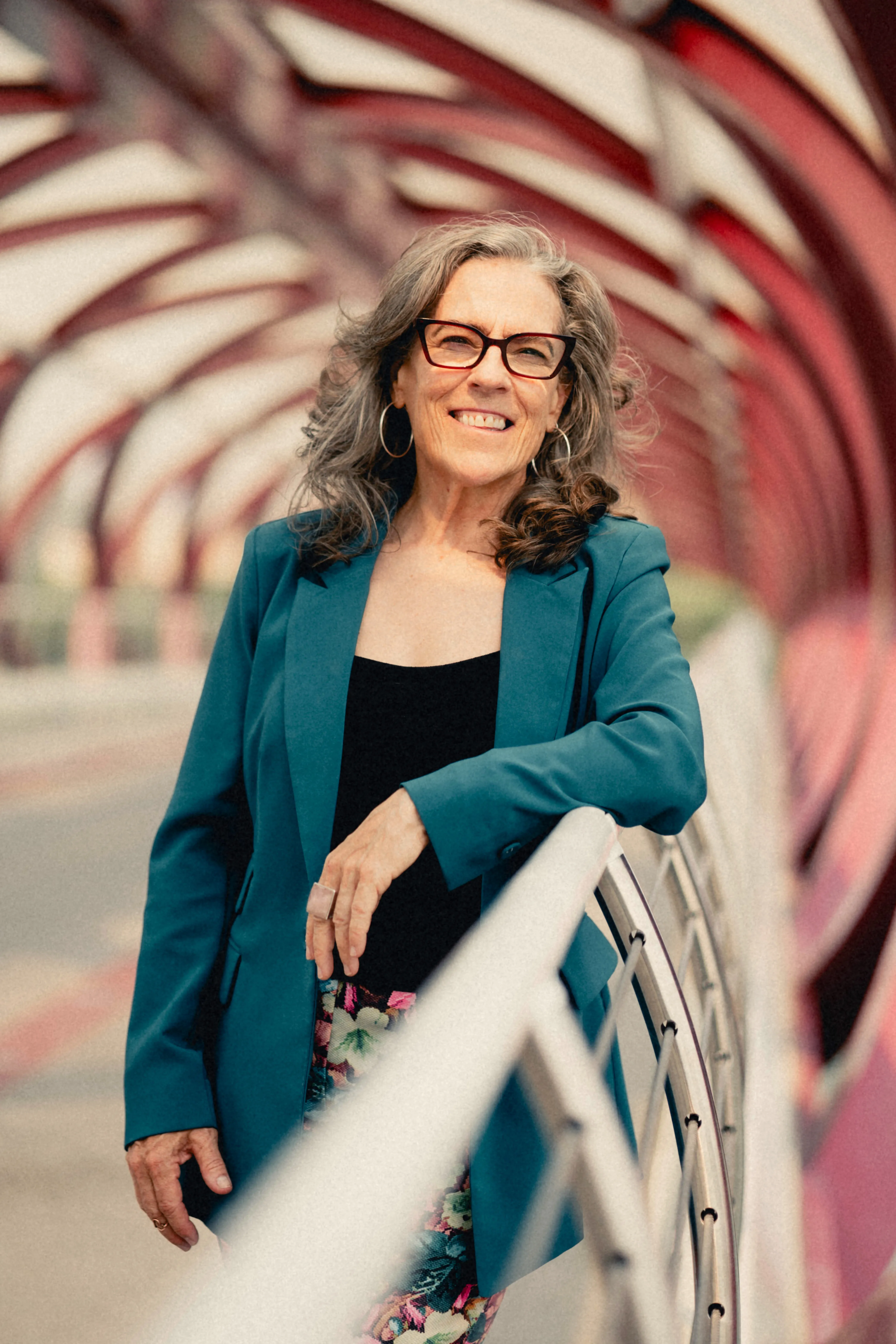 Heidi smiling in her teal blazer on the Peace Bridge